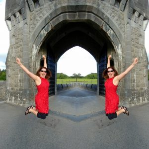 Lisa jumping for joy traveling in Ireland